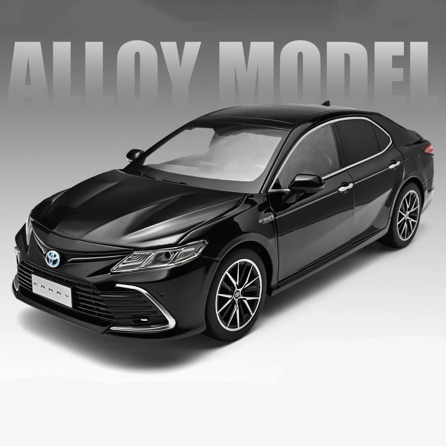 Voiture miniature Toyota Camry 1:18 noire, vue avant 3/4, carrosserie et calandre