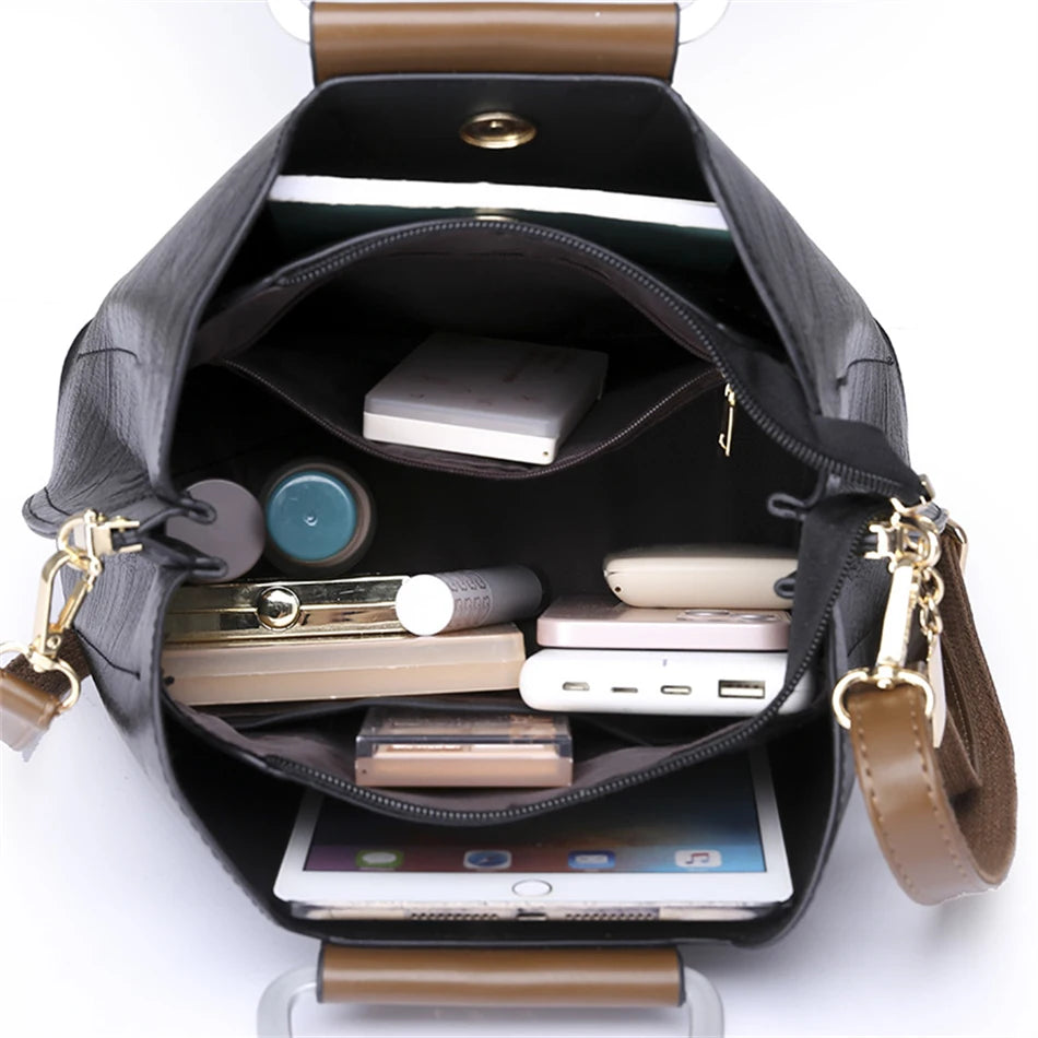 Sac fourre-tout noir ouvert, intérieur spacieux avec poches et fermeture éclair