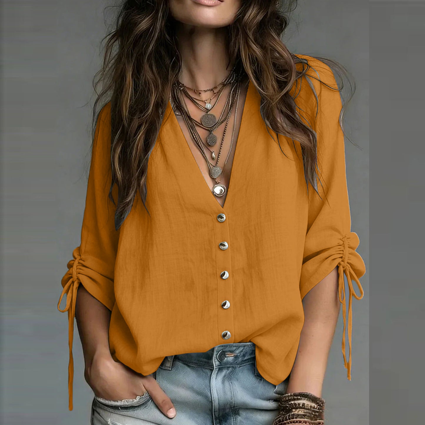 Blouse femme orange col V boutonné, manches nouées aux poignets