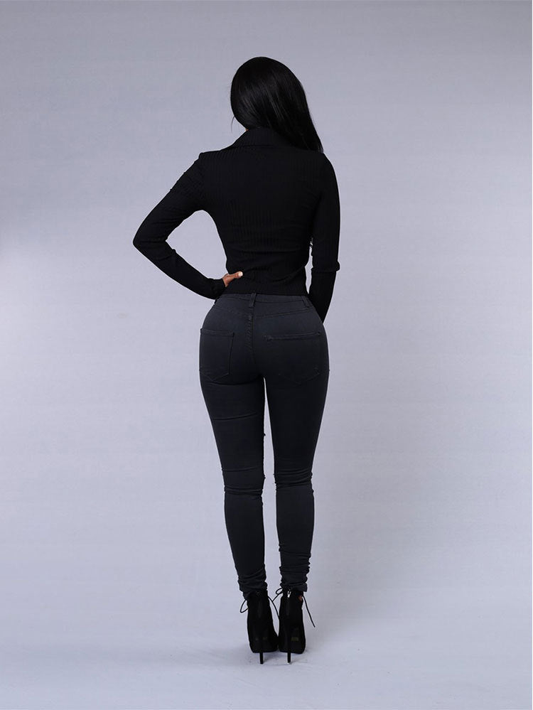 Jean skinny taille haute noir, vue arrière avec poches et bas fuselé