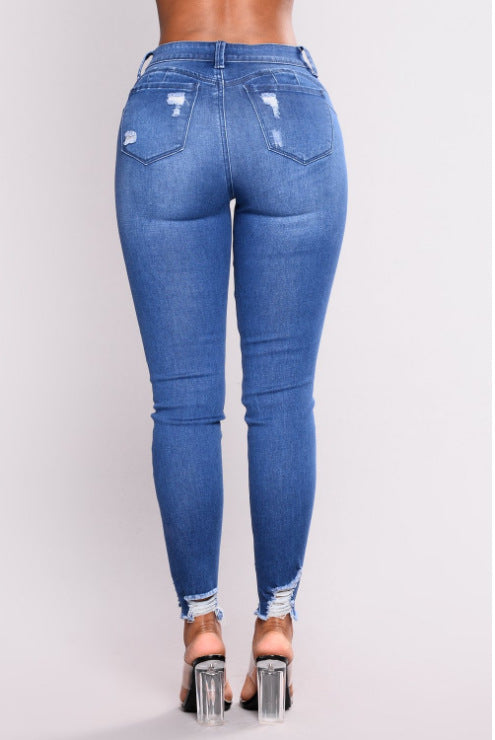 Jean femme bleu taille haute coupe crayon, dos avec poches et ourlet effiloché