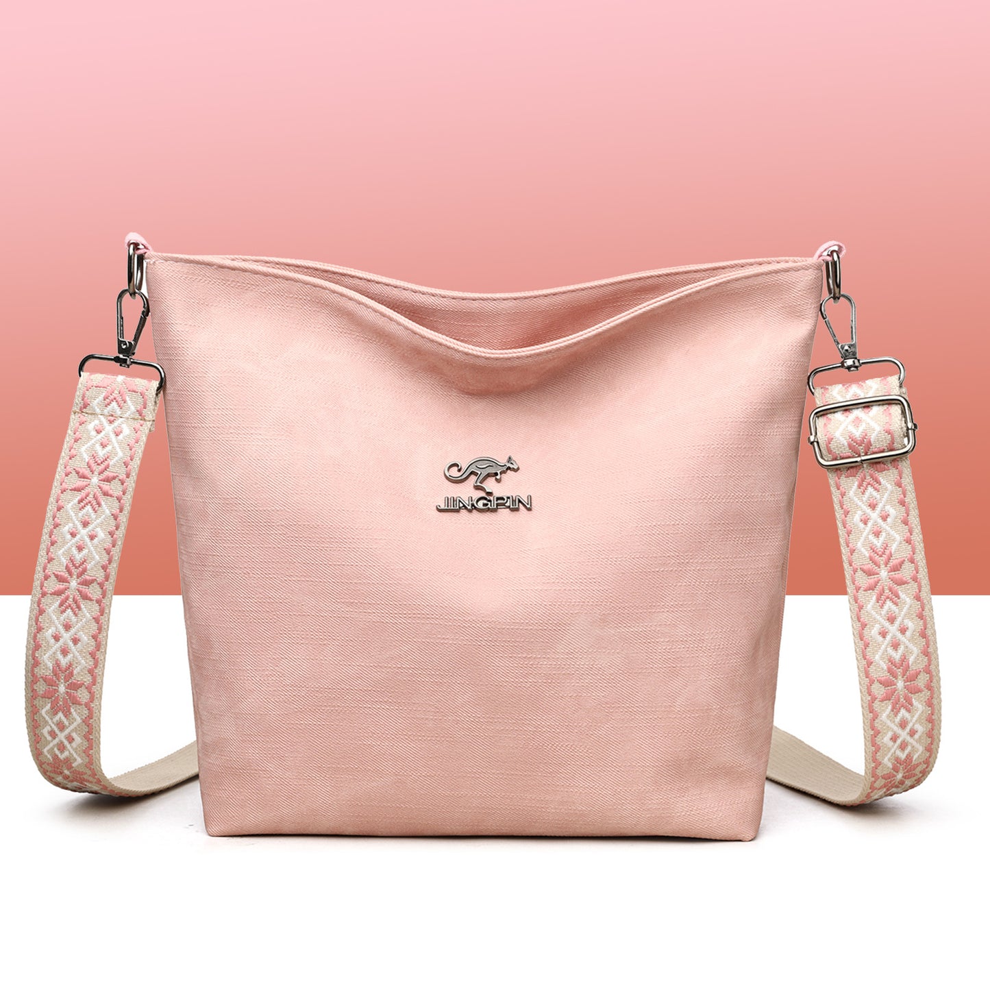Sac à main souple rose grand format avec bandoulière à motifs et logo, zip en haut