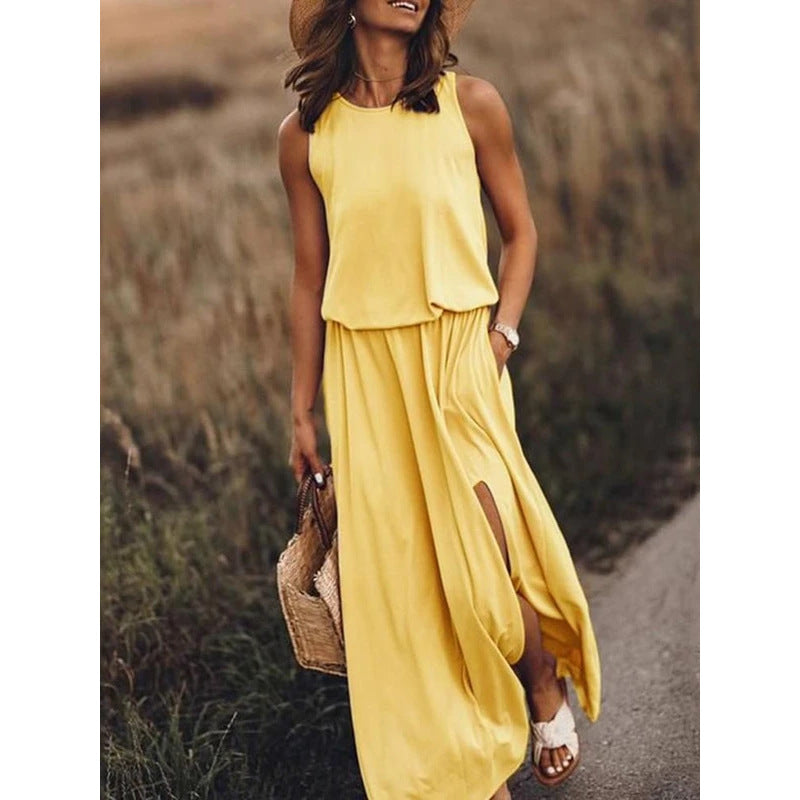 Robe longue sans manches jaune col rond, jupe ample, fente latérale et poches