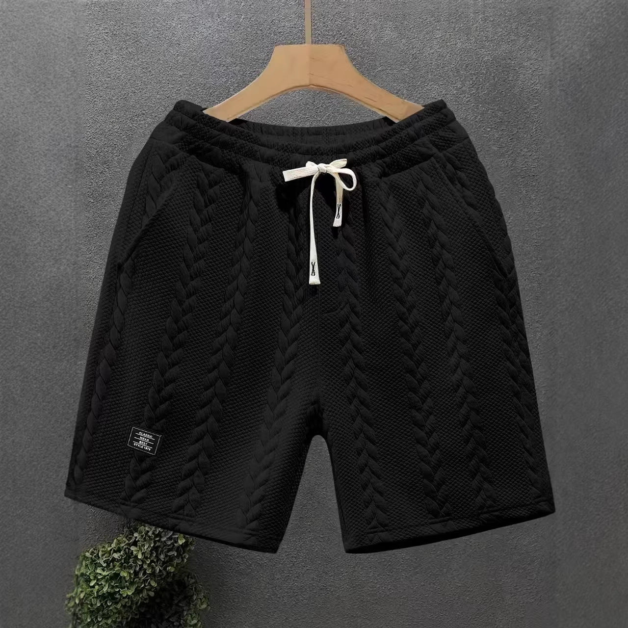 Short homme noir jacquard tressé, taille élastique et cordon à nouer