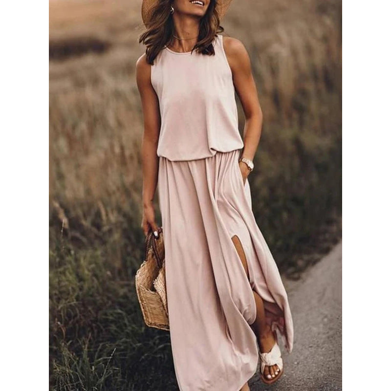 Robe longue sans manches à col rond, rose pâle, fente latérale et poches