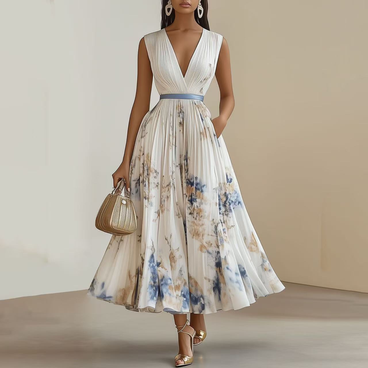Robe sans manches à taille haute imprimée, fond blanc et fleurs bleu.
