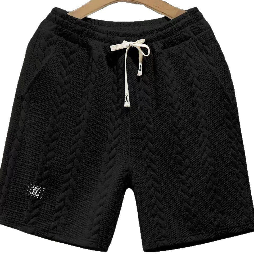 Short homme noir ample jacquard tressé, taille élastique et cordon à nouer