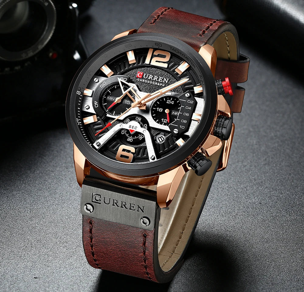 Montre chronographe bracelet cuir rouge-brun, boîtier noir, cadran noir à compteurs