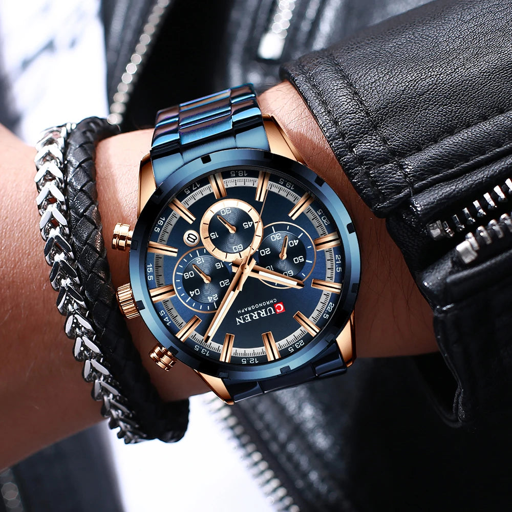 Montre homme CURREN chronographe, cadran bleu, bracelet acier bleu, détail des poussoirs dorés