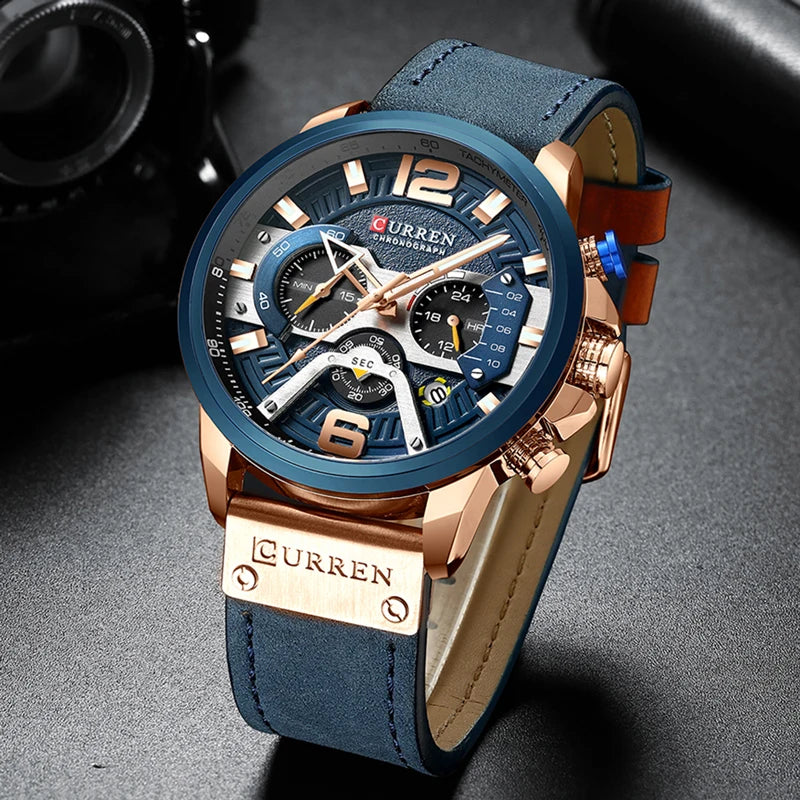 Montre chronographe cuir bleu, boîtier doré, cadran bleu multicomptes et lunettes bleues