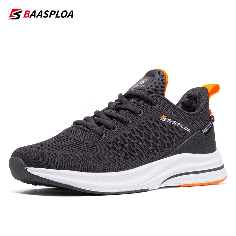 Chaussures de running homme noires et grises, semelle blanche, détails orange.