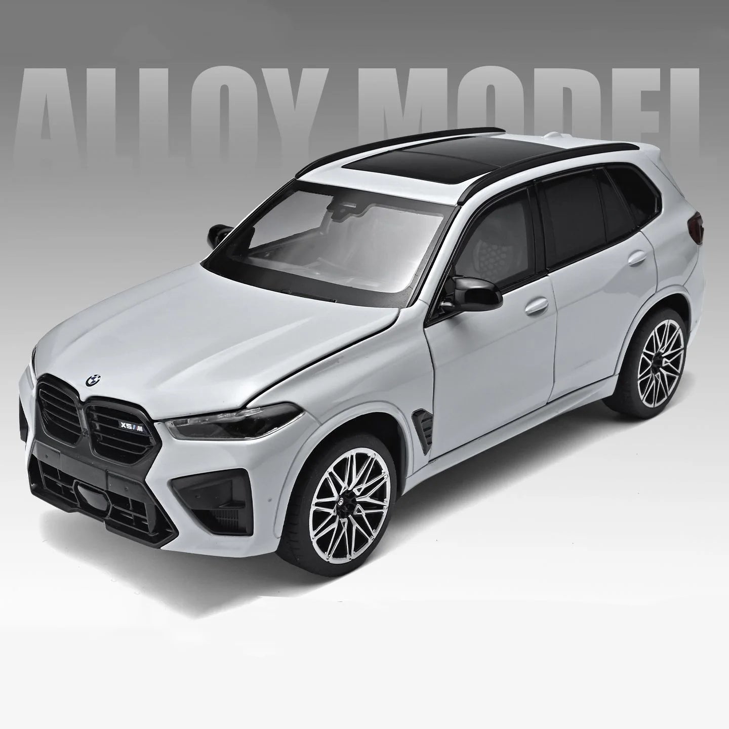 Voiture miniature SUV BMW X5M blanche, capot noir, jantes détaillées, phares avant