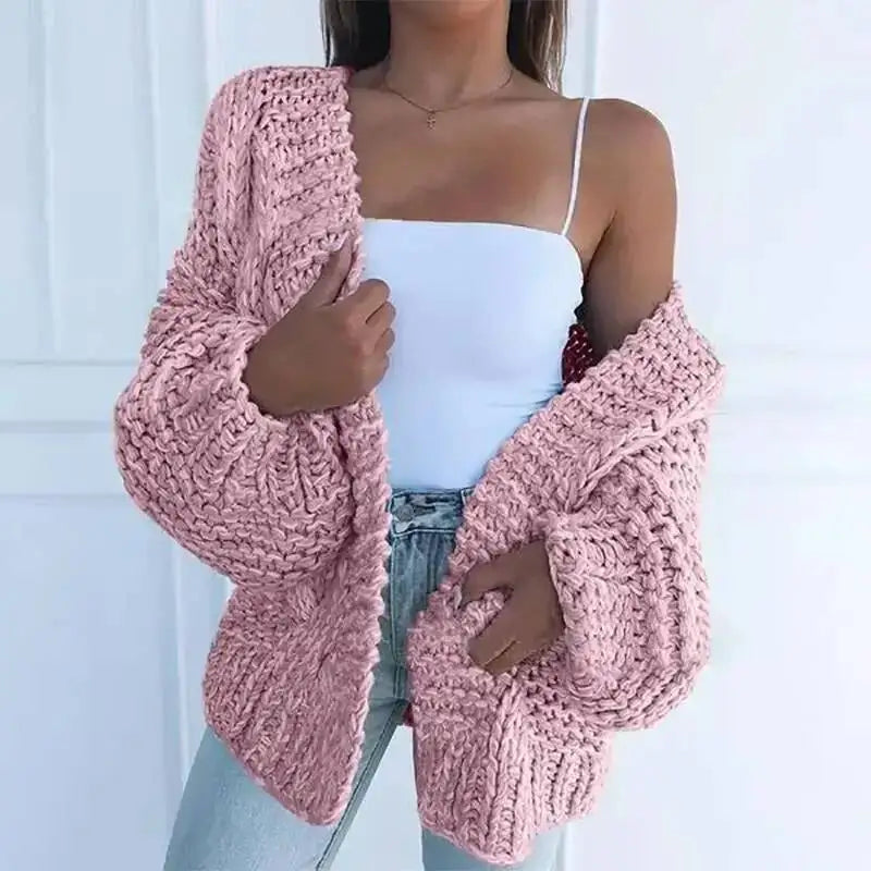Cardigan en maille rose mauve, manches chauve-souris amples et ouverture devant.