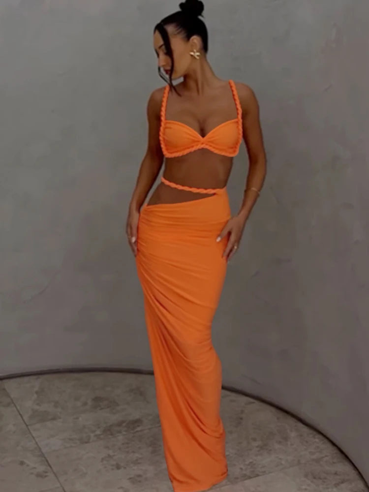 Ensemble femme orange : haut bandeau noué et jupe longue moulante, vue de côté