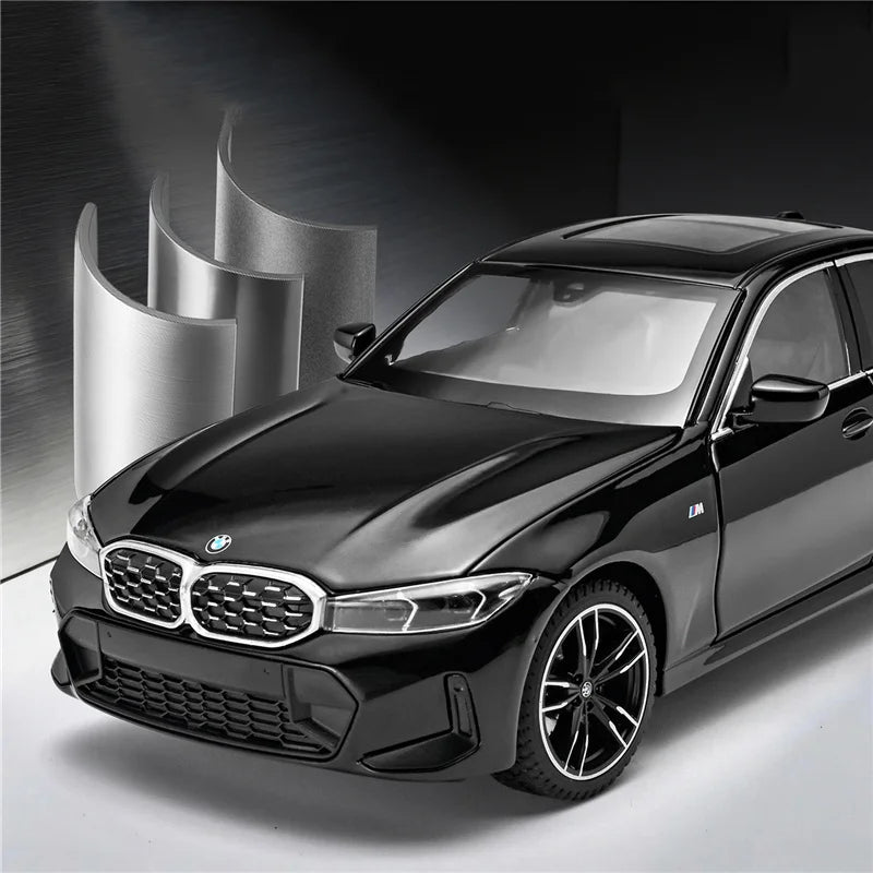Voiture miniature BMW Série 3 M Coupé noire, vue avant trois-quarts, jantes noires