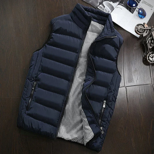 Gilet matelassé sans manches bleu foncé, fermeture zippée, col montant, poches zippées