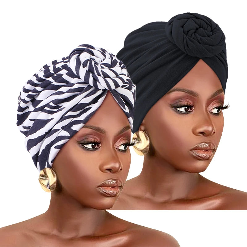 Lot de 2 turbans africains : un noir torsadé et un imprimé zébré blanc et noir.