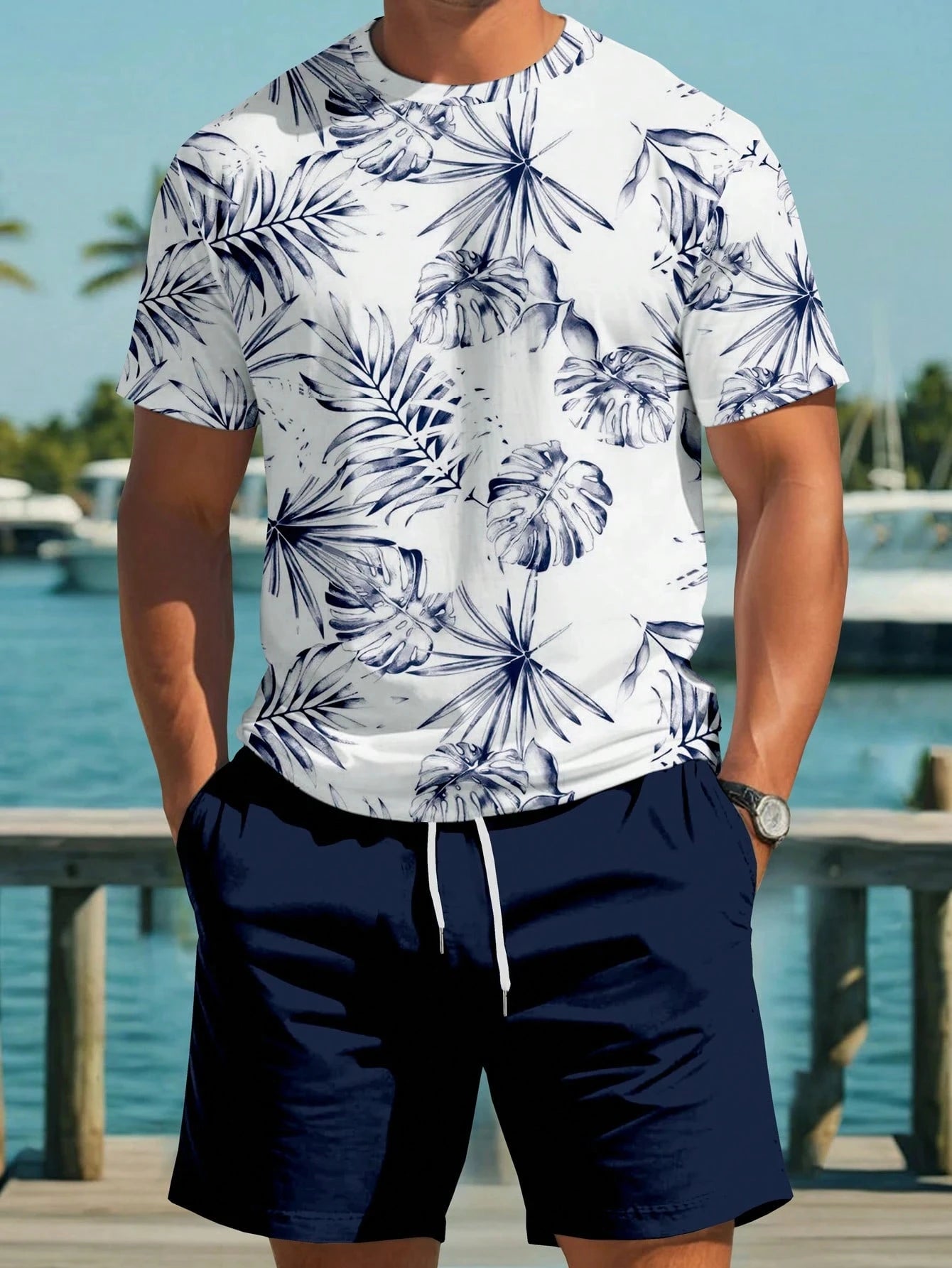 Ensemble t-shirt blanc à motif feuilles bleu, short bleu marine avec cordon