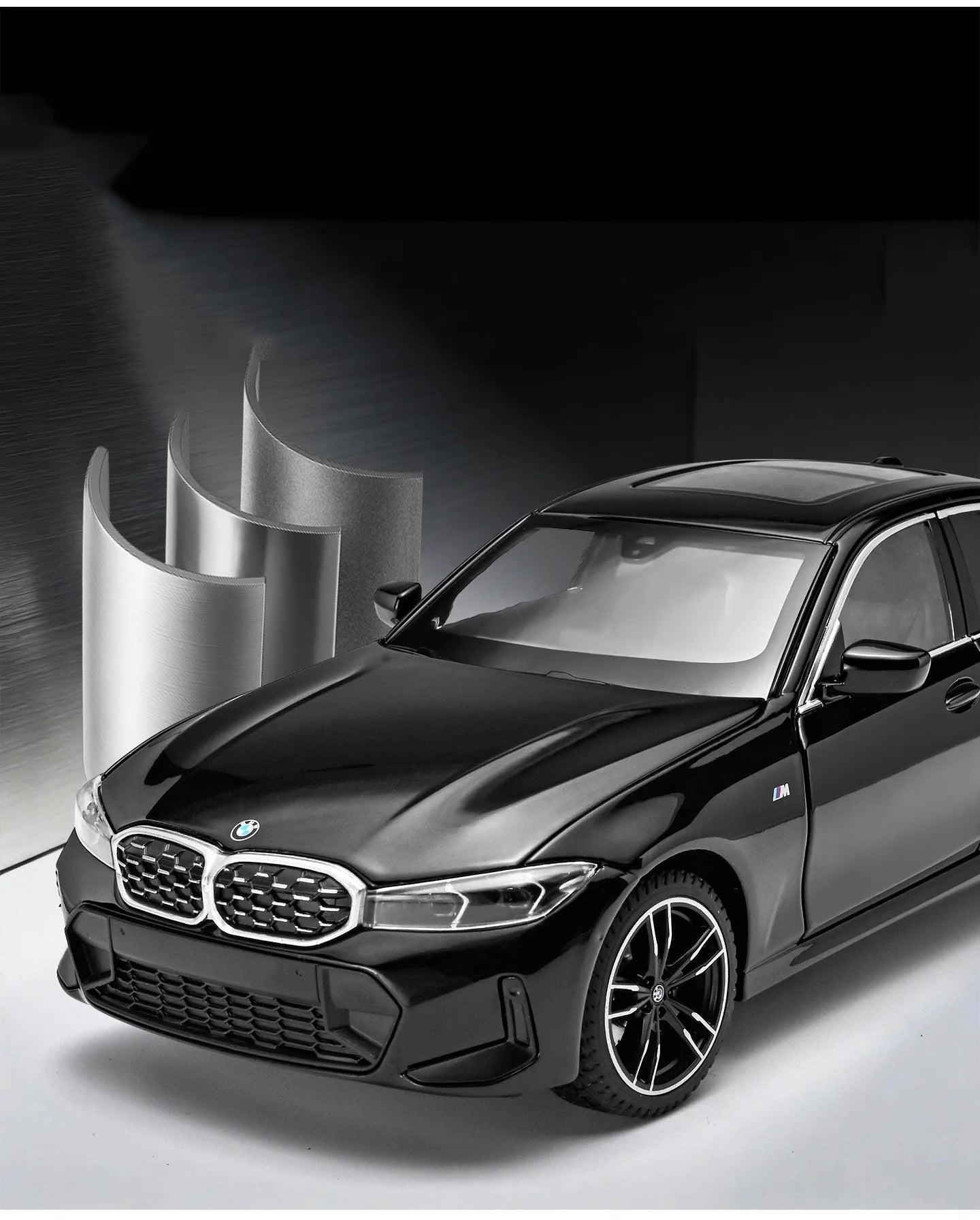 Voiture miniature BMW Série 3 M Coupé noire, vue avant trois-quarts, calandre