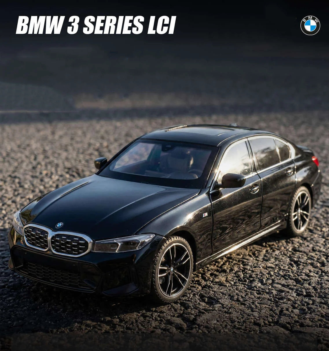 Voiture miniature BMW Série 3 M Coupé noire, vue avant trois-quarts sur gravier
