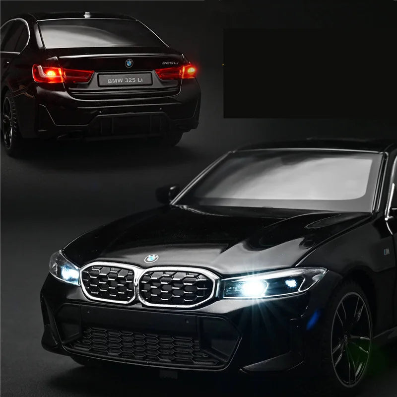 Voiture miniature BMW Série 3 M Coupé noire, vue avant avec phares allumés