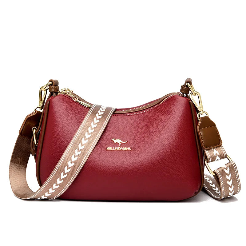 Sac bandoulière en cuir rouge bordeaux, bandoulière beige à motif blanc