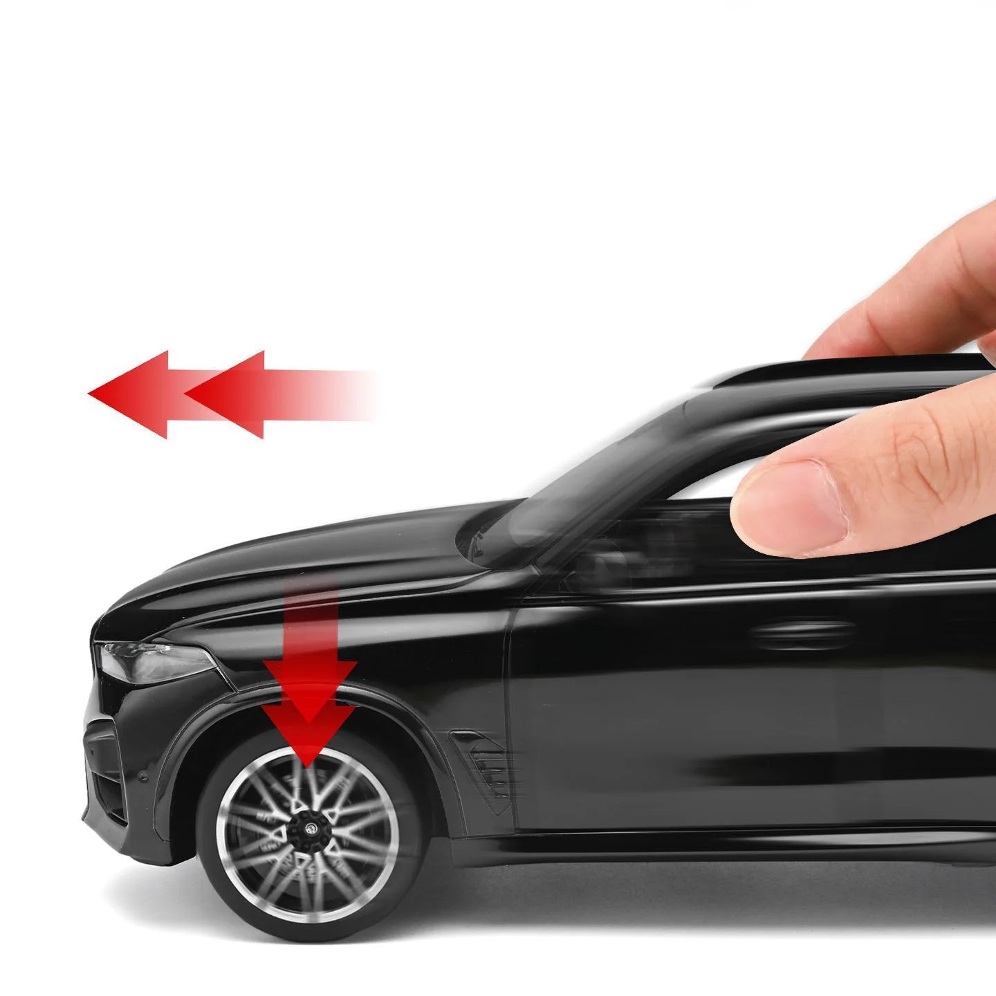 Voiture miniature BMW X5M noire, roue avant et main sur la carrosserie
