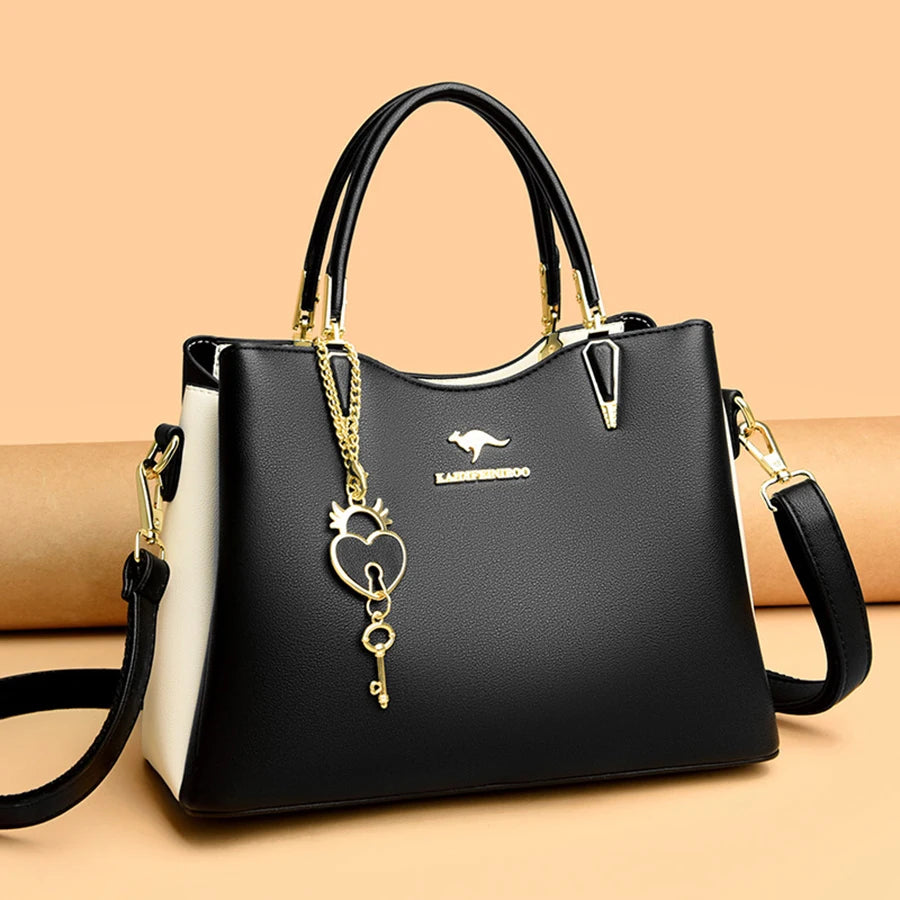 Sac à main fourre-tout noir avec doublure blanche et breloque cœur/verrou dorée