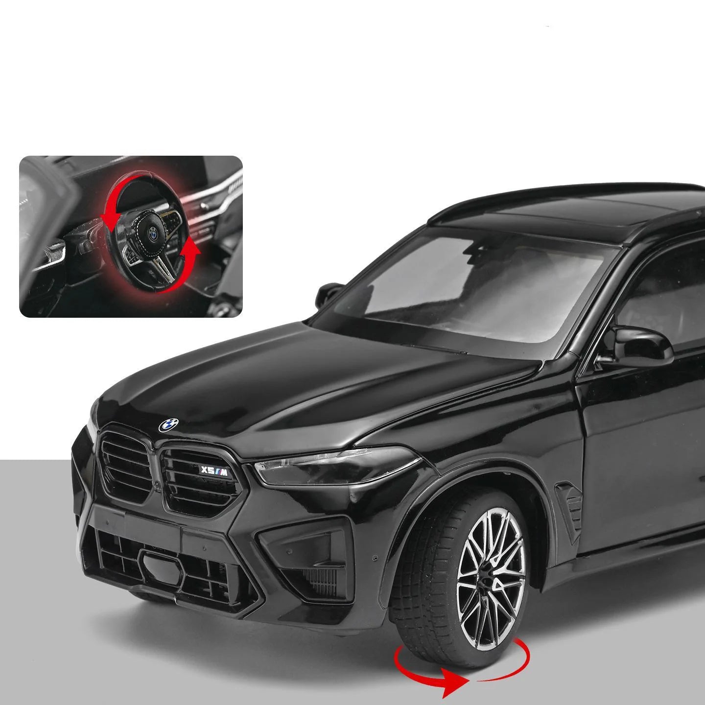 Voiture miniature BMW X5M noire, vue avant avec roue avant et volant, détails