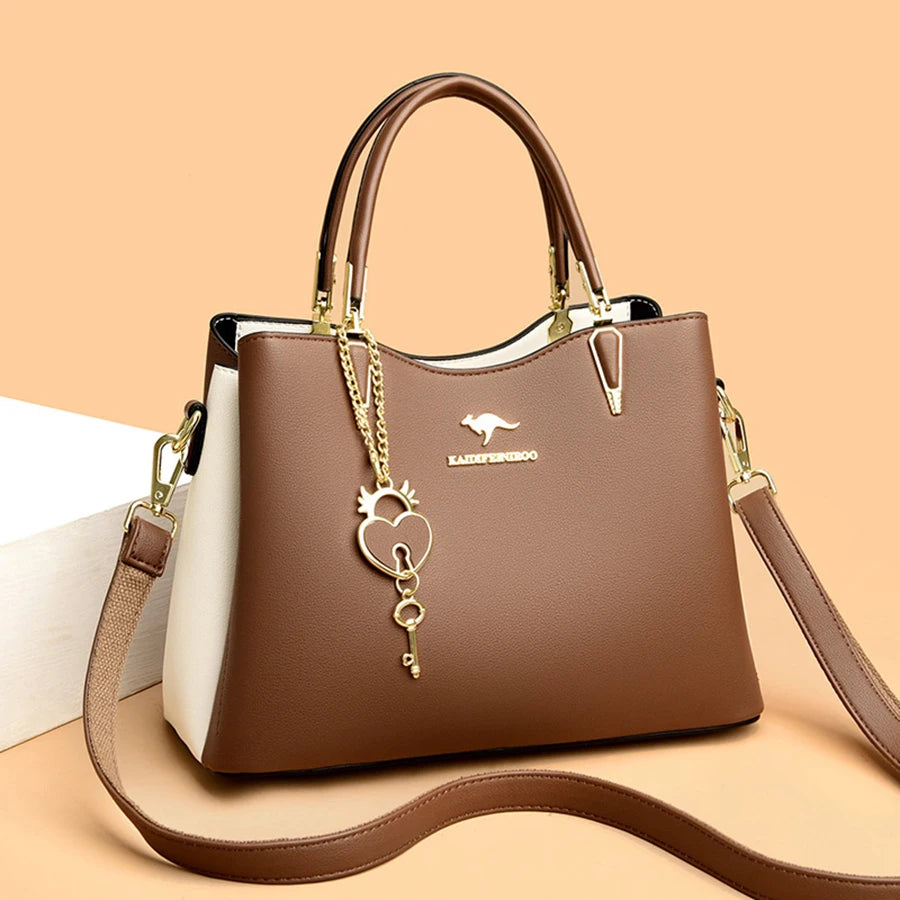 Sac à main fourre-tout brun avec doublure blanche et breloque cœur/verrou dorée