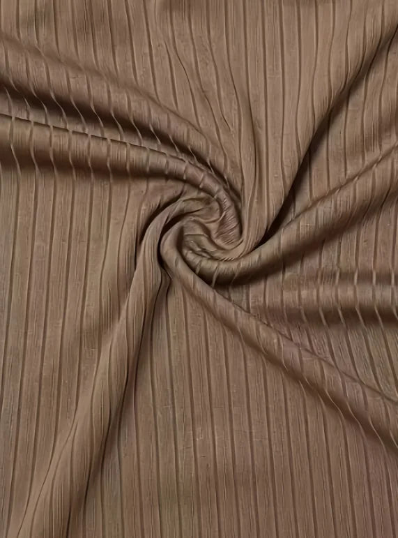 Tissu côtelé marron café, gros plan sur la texture et les nervures fines