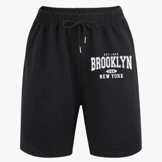 Short sport noir ample, taille élastique et cordon; motif Brooklyn USA New York