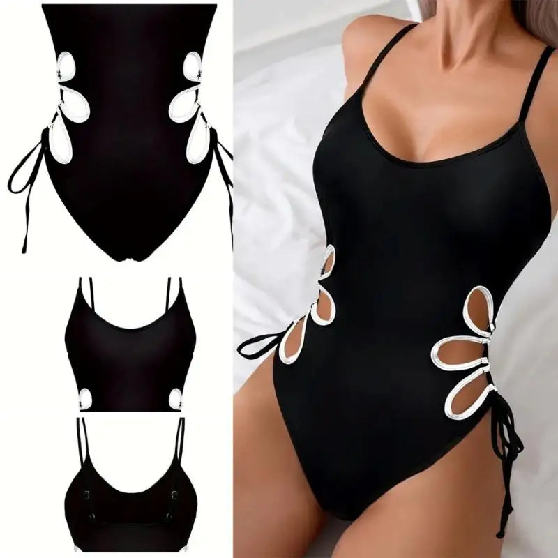 Maillot de bain une pièce noir avec découpes style gilet et nœuds latéraux.