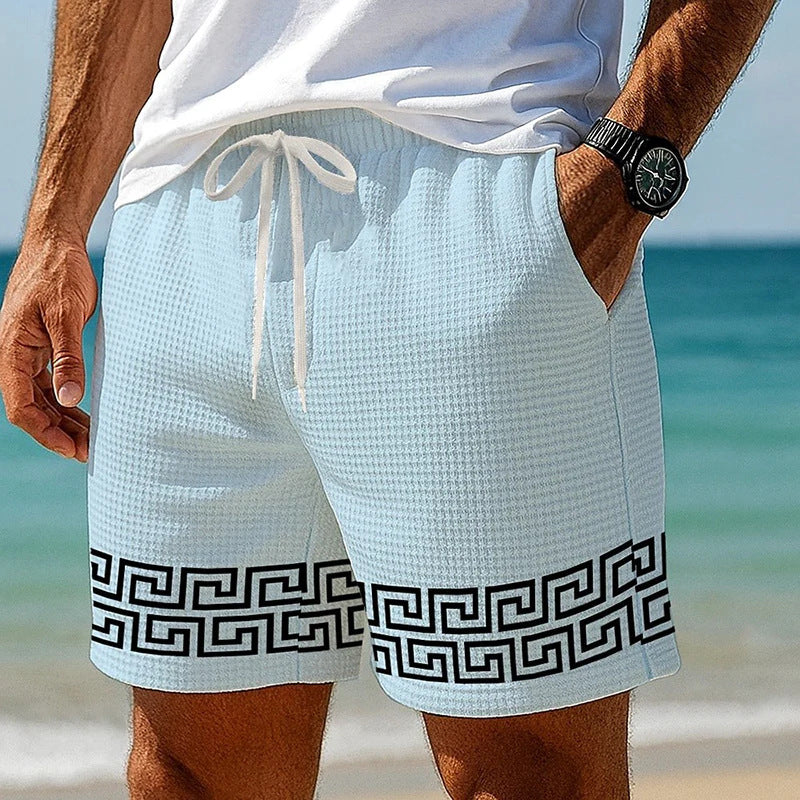 Short homme nid d’abeille bleu clair, cordon, bordure grecque noire au bas.