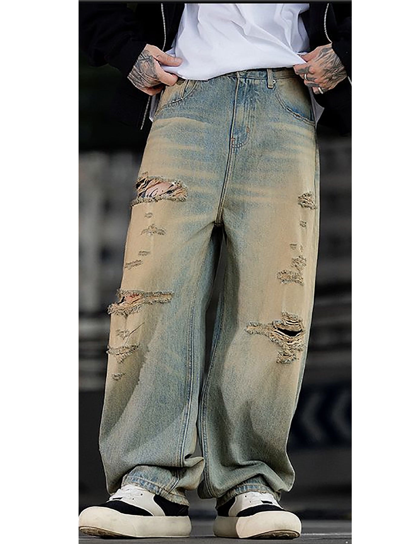 Pantalon slim stretch homme en jean bleu délavé, bords effilochés et trous aux genoux