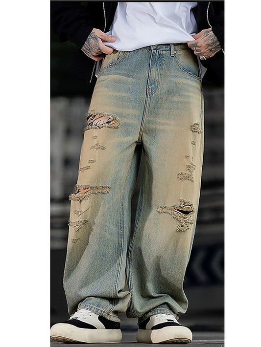 Pantalon slim stretch homme en jean bleu délavé, bords effilochés et trous aux genoux