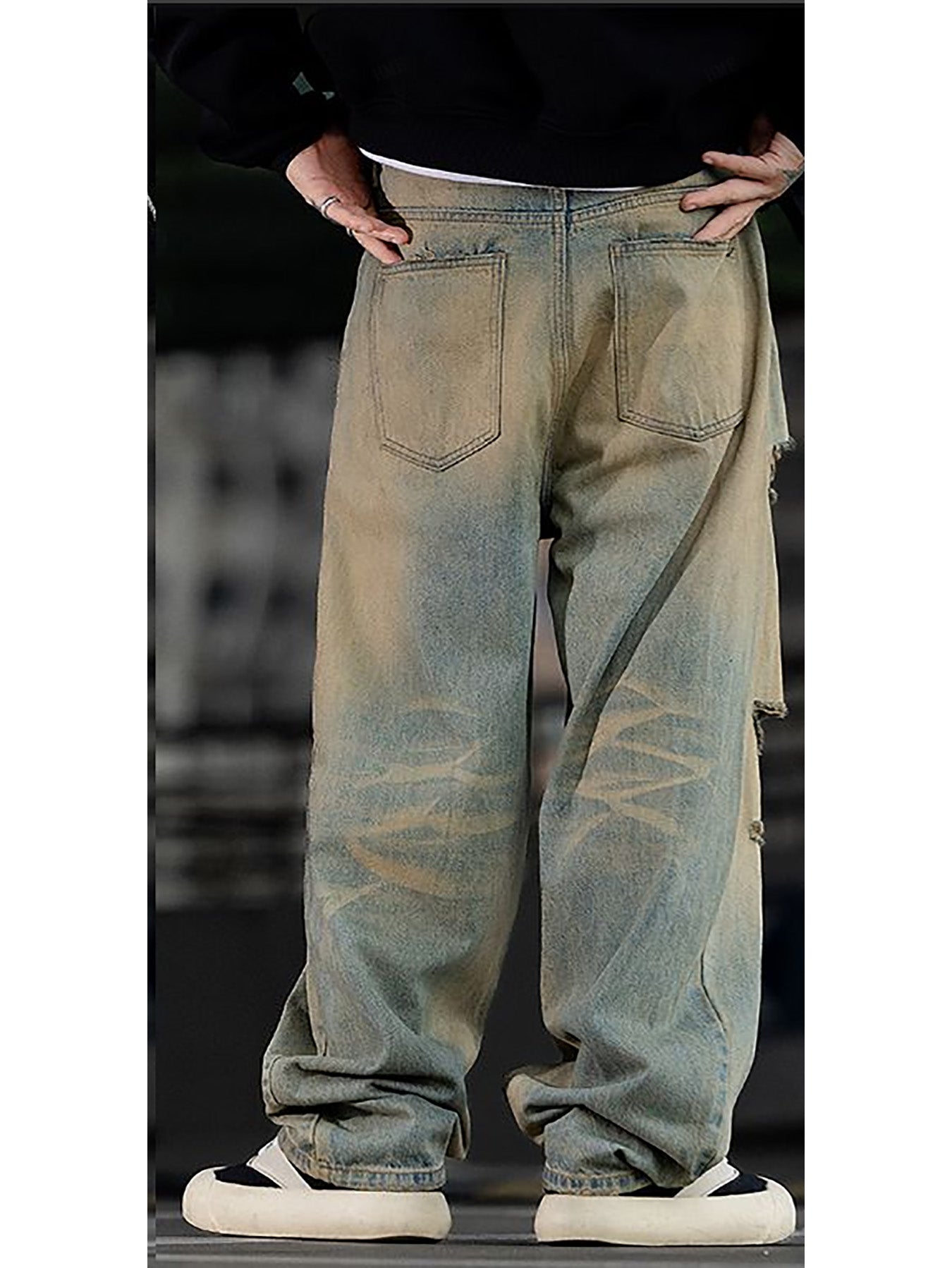 Pantalon slim stretch homme en jean délavé, poches arrière et déchirures décoratives