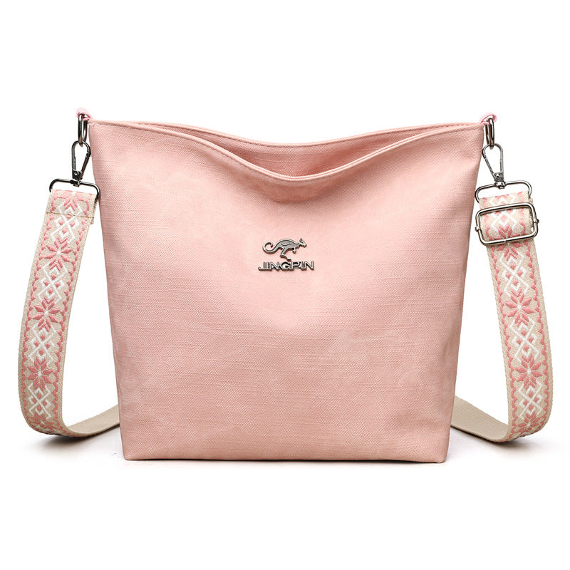 Sac à main souple rose grand format, bandoulière à motifs et logo, zip en haut